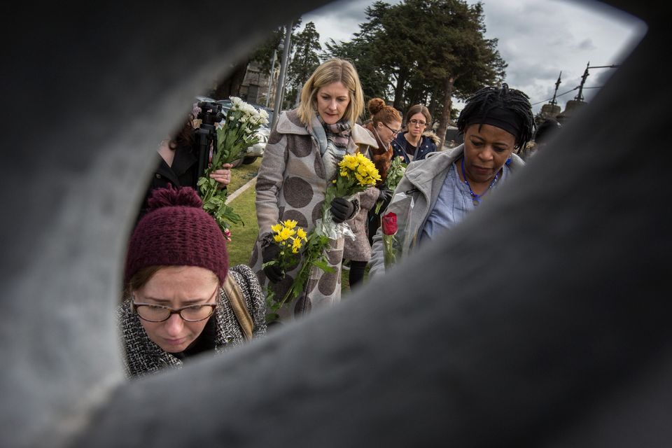 Flowers are laid to remember the women and girls who were incarcerated in Magdalene Laundries at Glasnevin Cemetery. Photo: Mark Condren