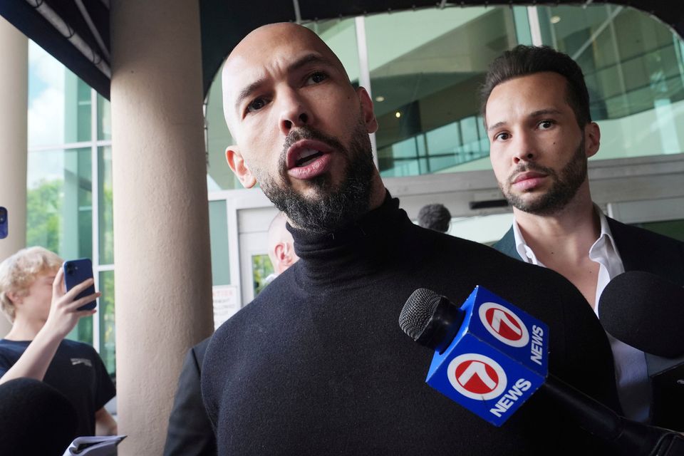 Brothers Andrew and Tristan Tate arriving in Fort Lauderdale, Florida, yesterday after travelling from Romania. Photo: AP