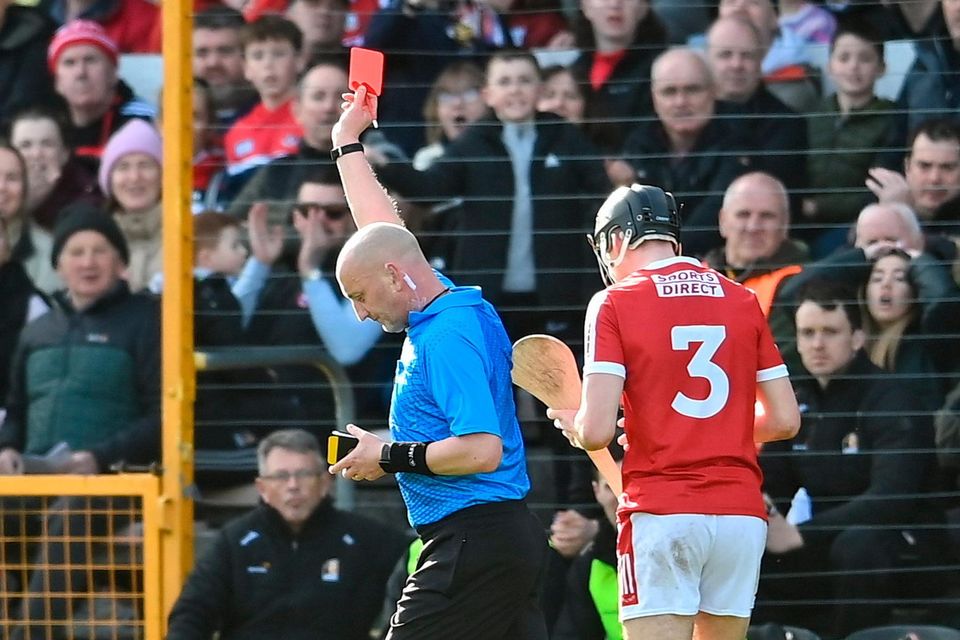 Referee John Keenan shows a red card to Cork's Eoin Downey at Nowlan Park. Photo: David Fitzgerald/Sportsfile