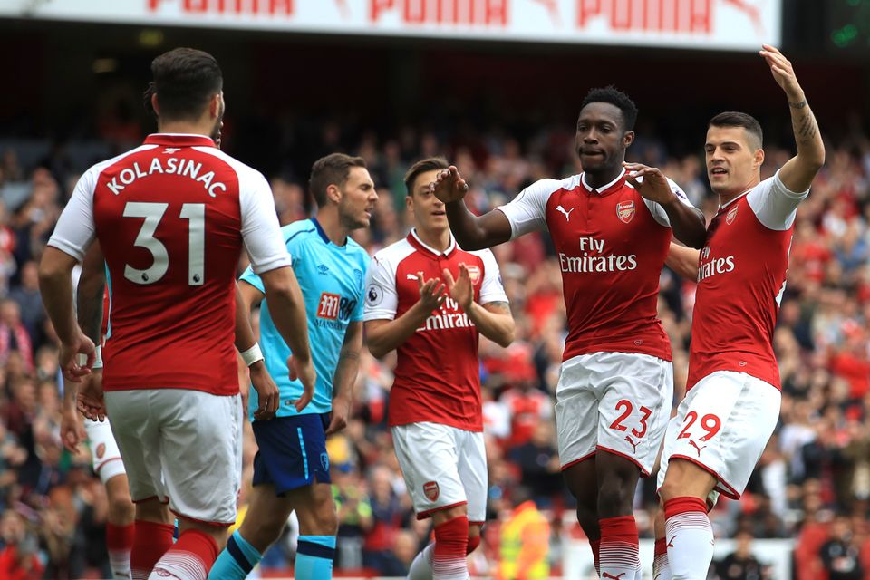 Danny Welbeck, second right, scored twice for Arsenal