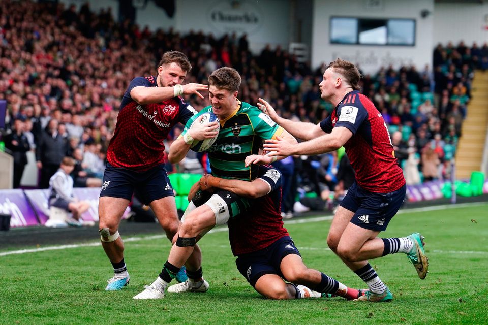 Northampton Saints' Tommy Freeman is tackled by Munster’s Antoine Frisch and Sean O’Brien (right) during the ECPR Challenge Cup match at Franklin's Gardens, Northampton