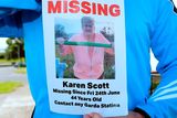 thumbnail: Next-door neighbour Robert Burke holds a Missing flyer for Karen Scott, missing since Friday 24th June.  Barnamore Grove, Finglas, Dublin. Picture: Caroline Quinn