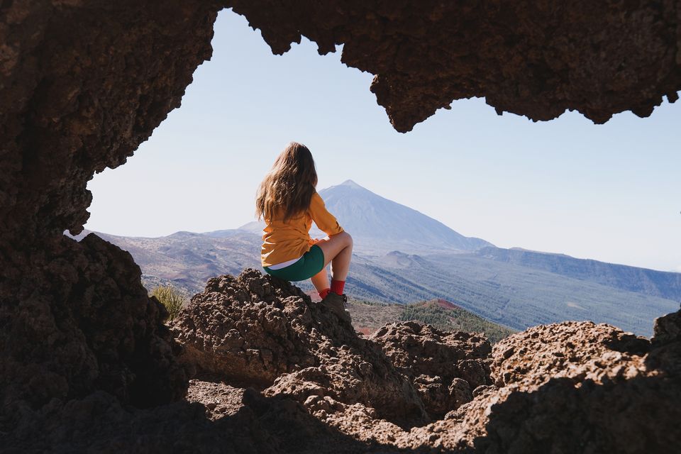 Roz at the rock arch by Puerto de Izana