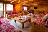 thumbnail: The living room at Chalet Alisier, and yes, the piano is tuned up