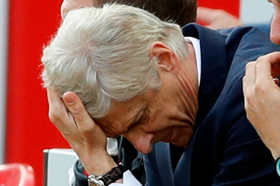 Arsenal manager Arsene Wenger looks dejected during the match against Liverpool at Anfield.   Photo: Carl Recine/Reuters