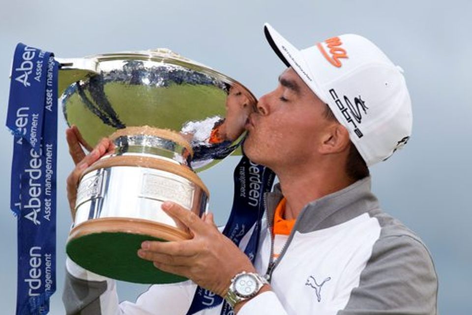Rickie Fowler kisses the trophy after winning the Scottish Open at Gullane Golf Club