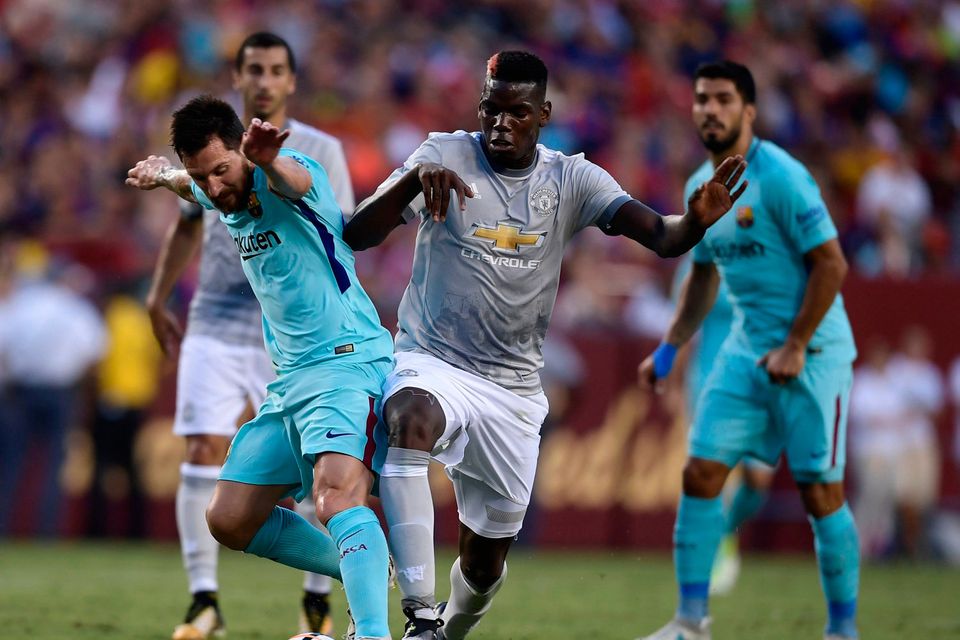 Lionel Messi of Barcelona (L) and Paul Pogba of Machester United (R)