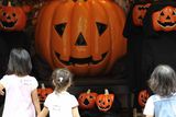 thumbnail: Children look at a pumpkin display at the Marunouchi shopping district in central Tokyo, Getty Images
