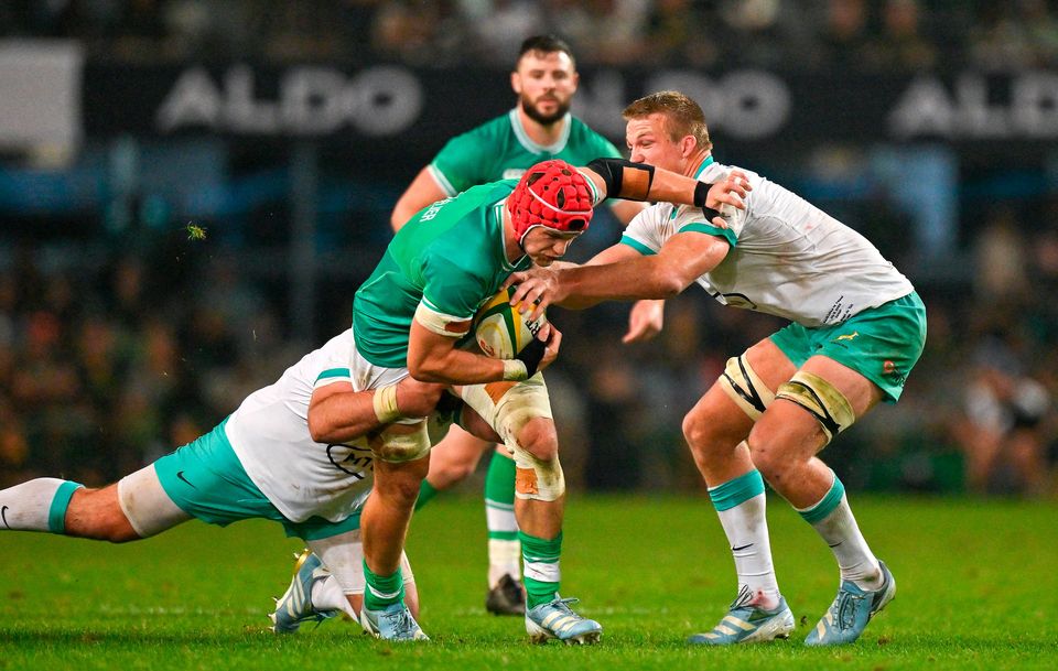 Josh van der Flier of Ireland is tackled by Frans Malherbe and Pieter-Steph du Toit of South Africa during the second Testat Kings Park in Durban, South Africa. Photo: Brendan Moran/Sportsfile
