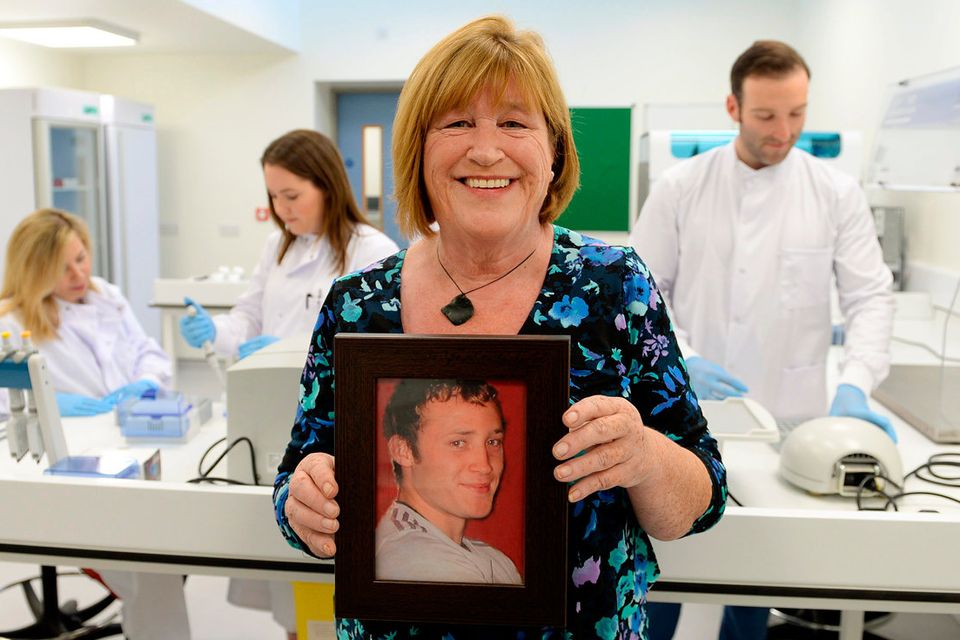 Maureen Kelly at the opening of the new laboratory in the Mater Hospital, holding a picture of her son Darragh, who died of Sudden Adult Death Syndrome. Photo: Caroline Quinn