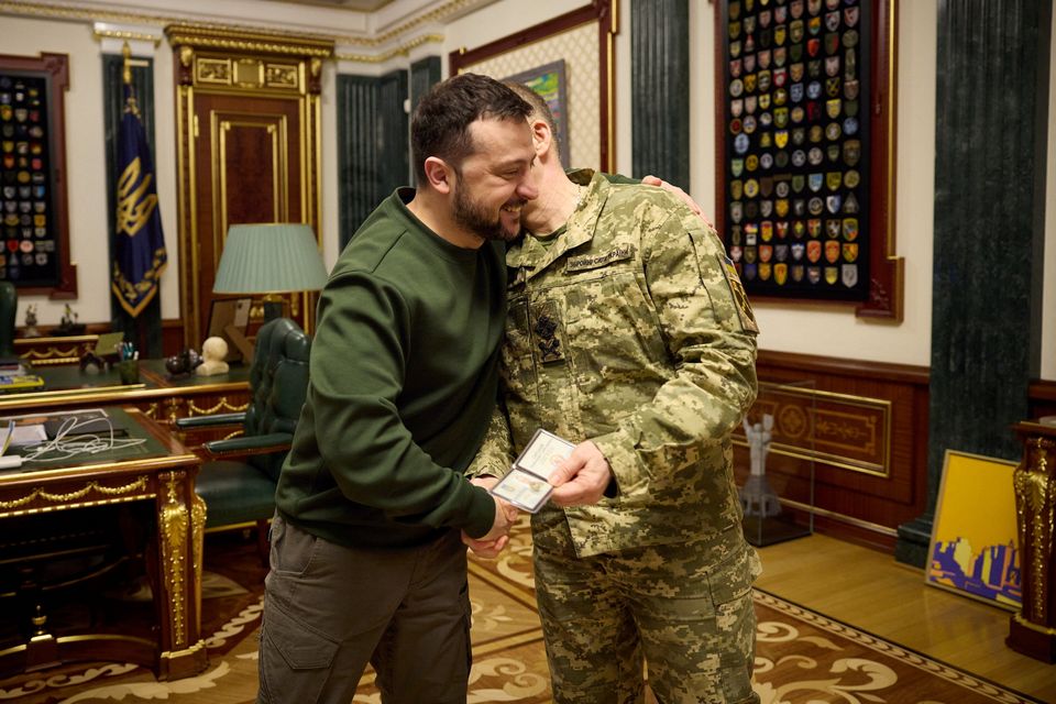 Ukraine's President Volodymyr Zelensky and his new Commander in Chief Col Gen Oleksandr Syrskyi embrace after a meeting at the weekend. Photo: Reuters