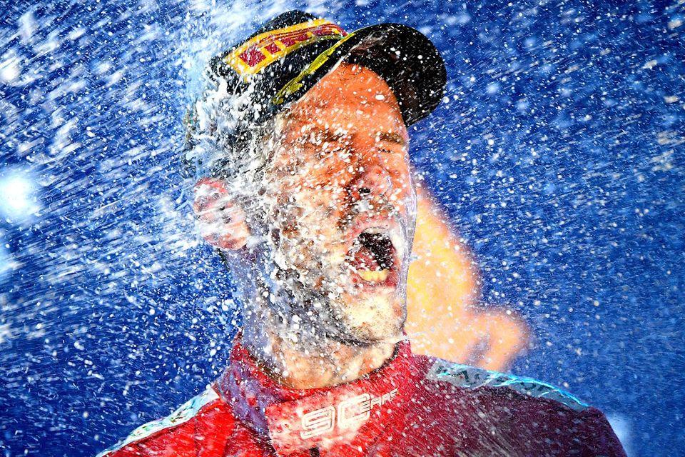 Ferrari’s Sebastian Vettel celebrates after ending his year-long wait for a Grand Prix victory. Photo: Clive Mason/Getty Images