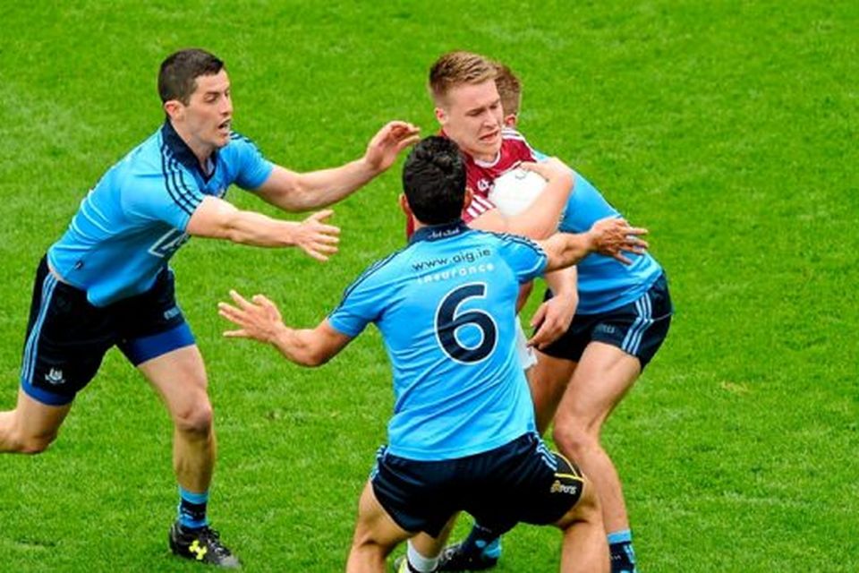 Paddy Holloway, Westmeath, in action against Dublin players, left to right, Rory O'Carroll, Cian O'Sullivan, and John Cooper