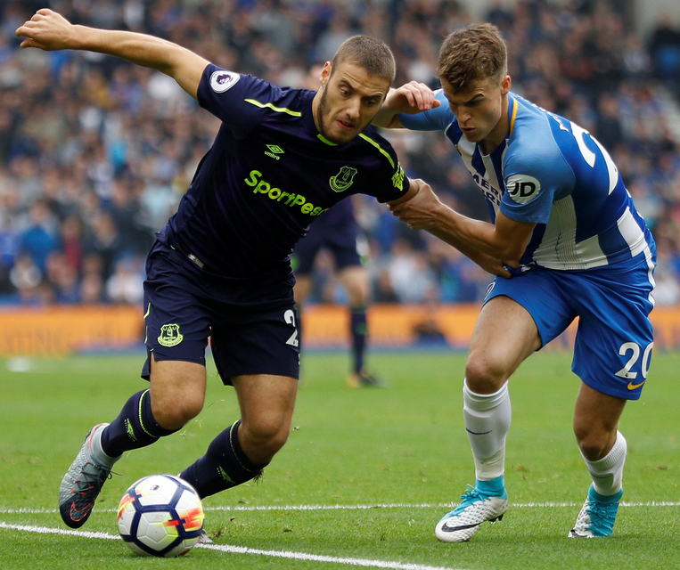 Everton's Nikola Vlasic keeps possession from Brighton’s Solly March. Photo: Reuters.
