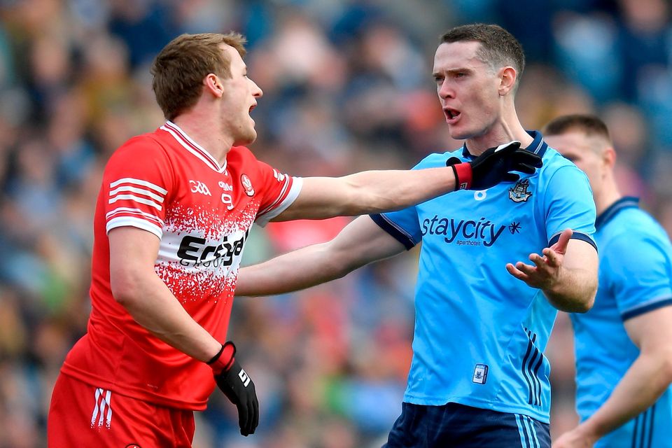 Derry's Brendan Rogers and Dublin's Brian Fenton. Photo: John Sheridan/Sportsfile