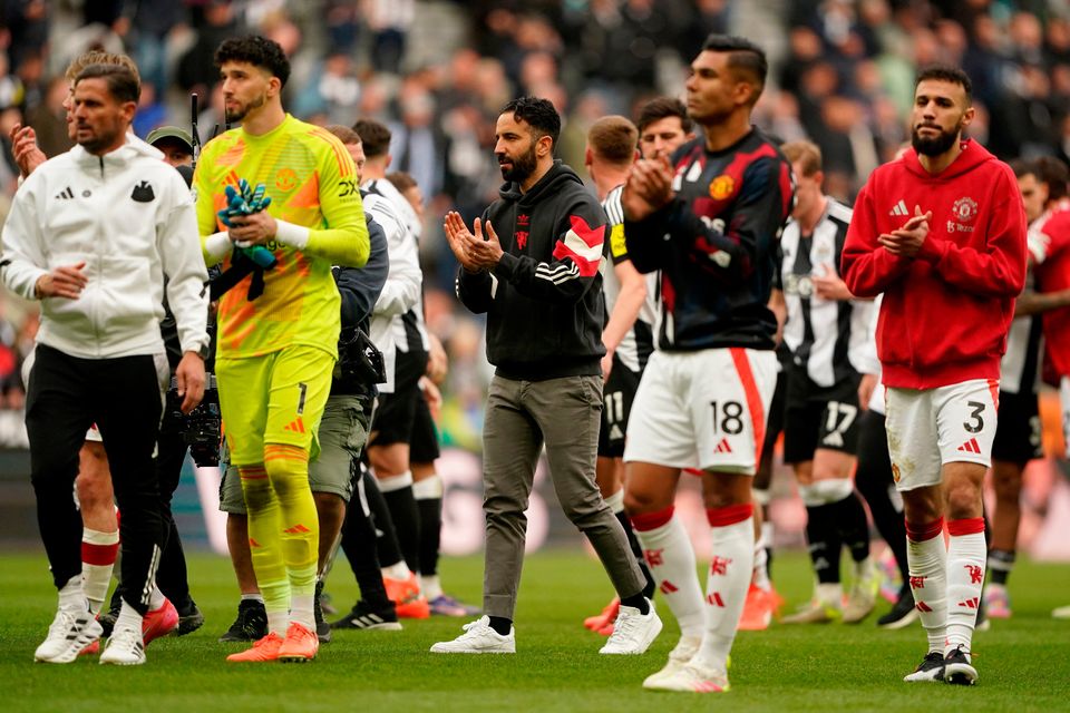 Manchester United manager Ruben Amorim (centre) applauds the fans after the Premier League match at St James' Park.