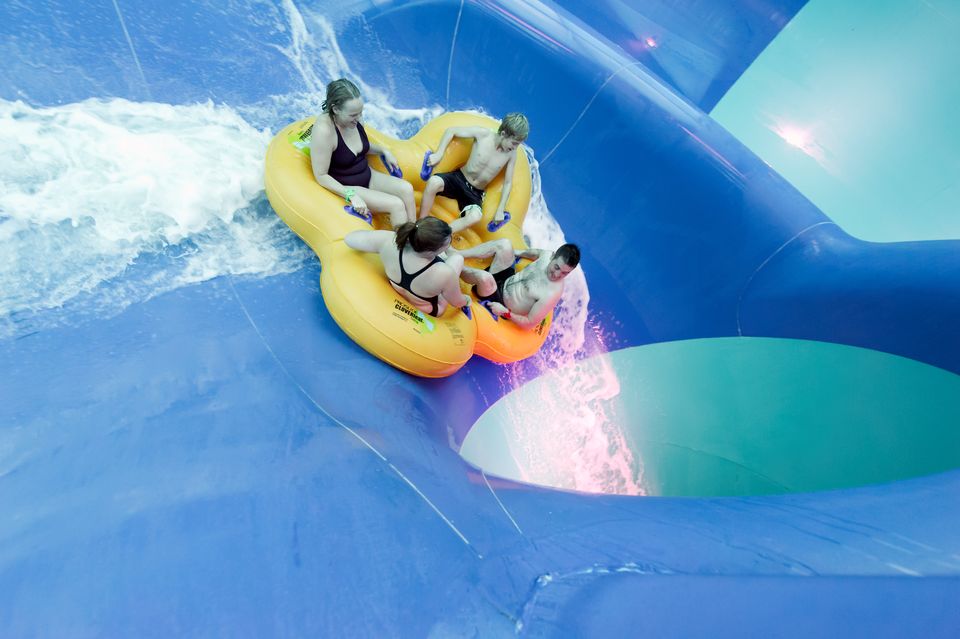 A family on the edge of the 45-degree drop in Tropical Cyclone in Center Parcs Elveden Forest in the UK
