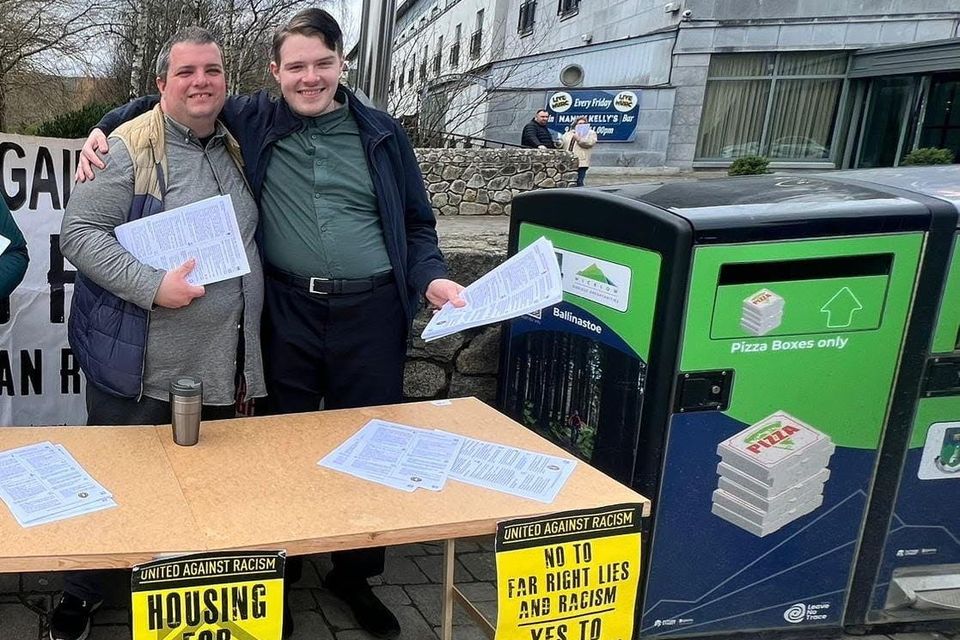 Lee Donnelly (left), with independent local election candidate Colm Flood, at a United Against Racism stall, in Newtownmountkennedy, in April 2024. 