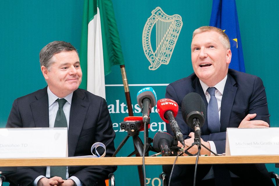 Ministers Paschal Donohoe (left) and Michael McGrath hail the budget numbers. Photo: Gareth Chaney/Collins Photos