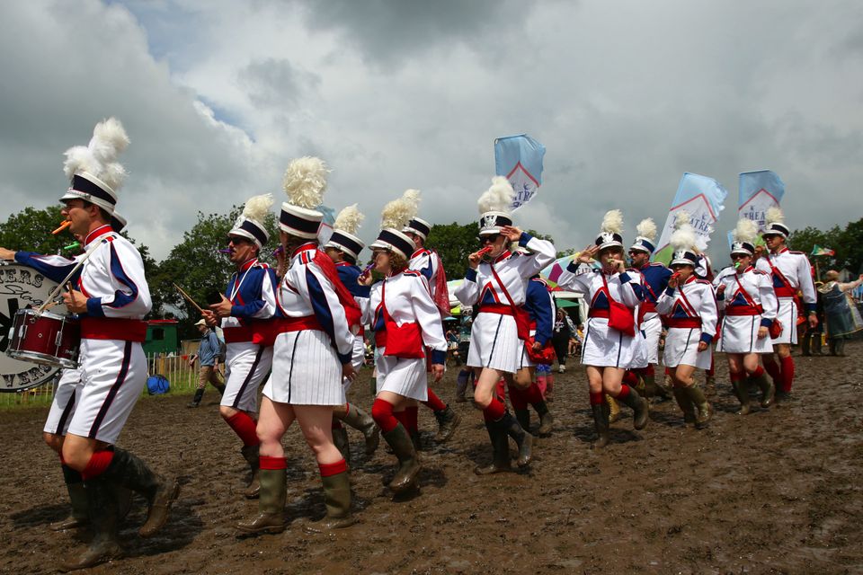 The Masters of the Kazooniverse band march through the festival