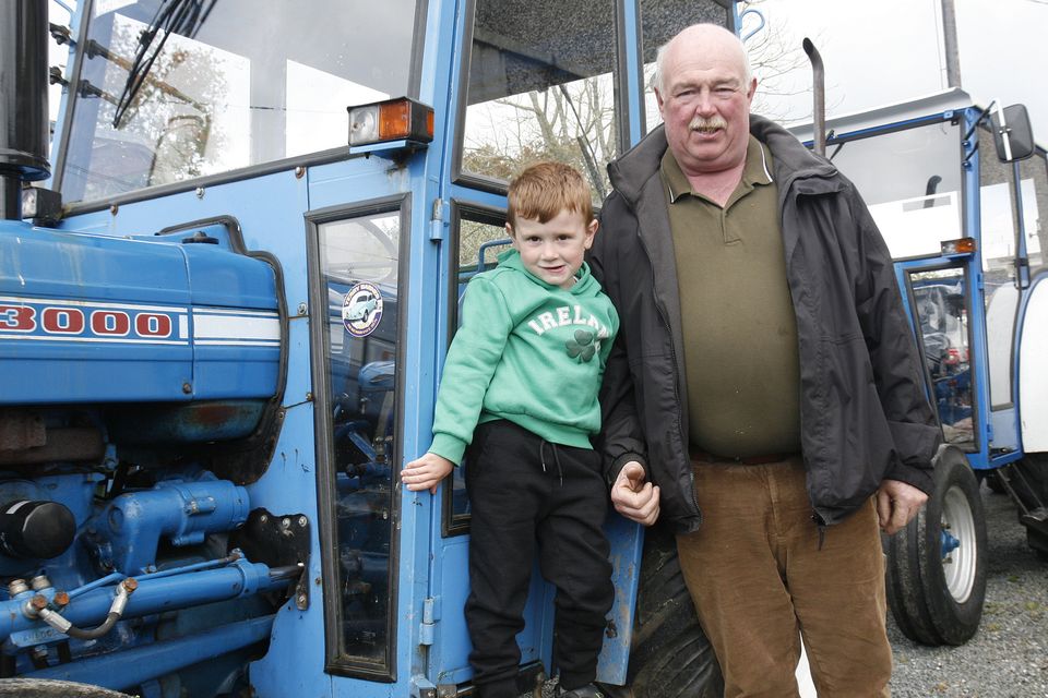 Jack Cooney and grandad Syl Boland at the Terry Barnes Memorial Tractor Run in Caim.