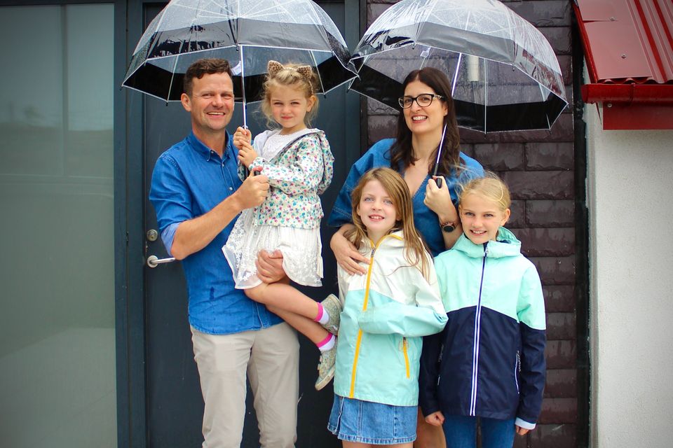 Kevin Coughlan and Elaine Mackenzie-Smith with their three children outside their 300-year-old Wicklow cottage for Home of the Year on RTÉ