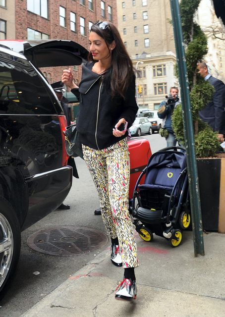 4: Amal in bomber jacket and printed pants in New York.