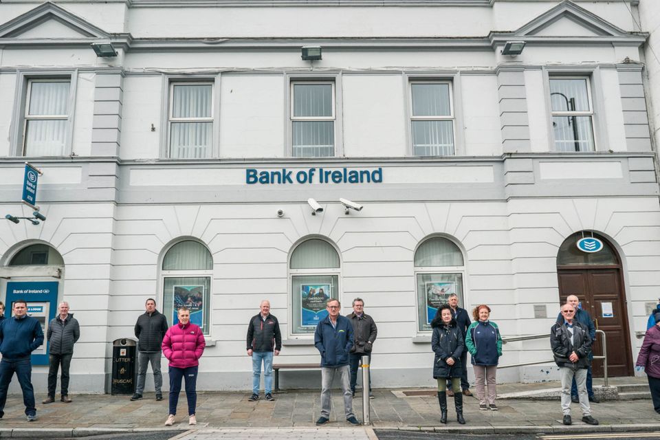 Withdrawal: Residents of Ballyhaunis, Co. Mayo outside the local Bank of Ireland closed due to the pandemic. Photo : Keith Heneghan