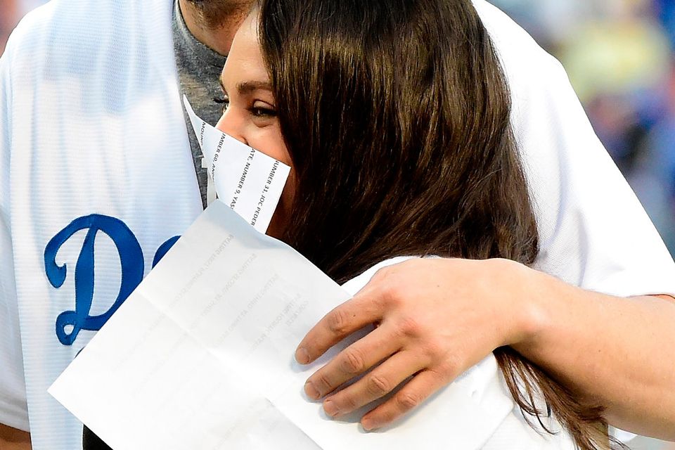 Pregnant Mila Kunis and hubby Ashton Kutcher put on PDA in matching outfits  at LA Dodgers crucial playoff game