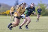 thumbnail: Ashford's Aibhinn Doyle is watched by Clan na Gael's Millie Free. 