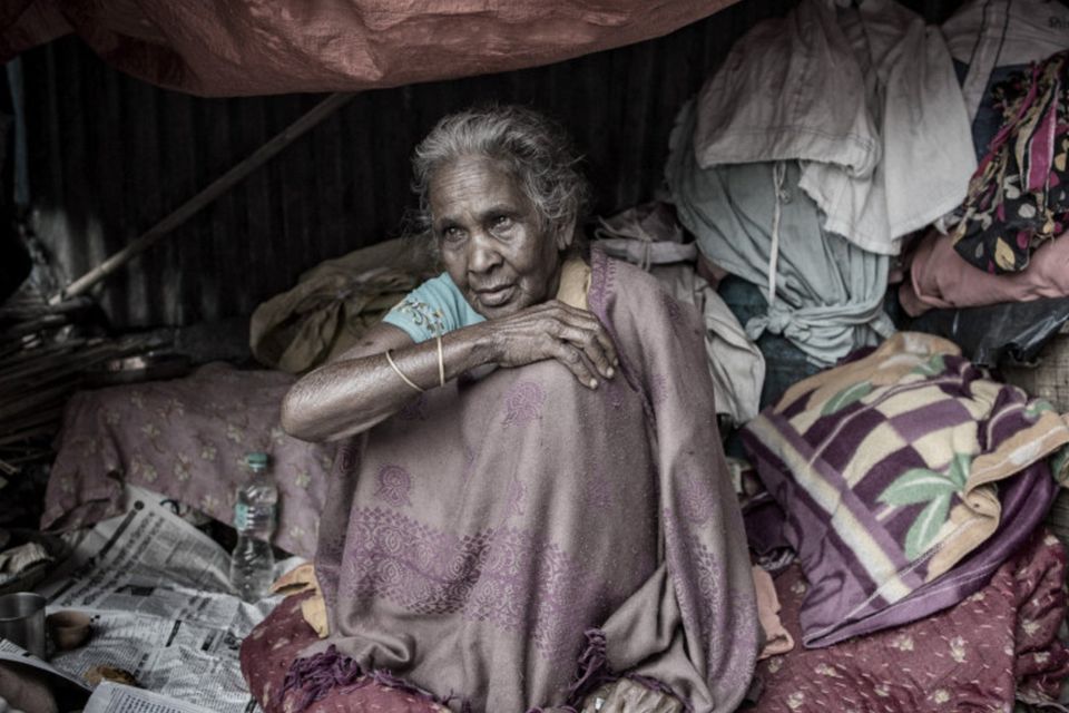An elderly woman living in her makeshift home near Howrah bridge in Kolkata. Photo: Arthur Carron
