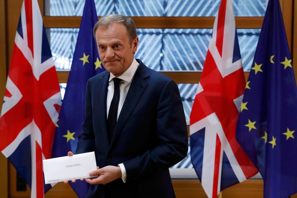 EU Council President Donald Tusk holds British Prime Minister Theresa May's Brexit letter which was delivered by Britain's permanent representative to the European Union Tim Barrow (not pictured) that gives notice of the UK's intention to leave the bloc under Article 50 of the EU's Lisbon Treaty in Brussels, Belgium, March 29, 2017. Photo: REUTERS/Yves Herman