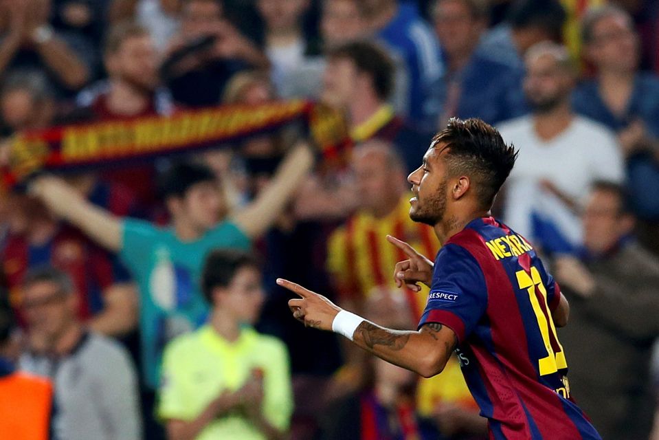 Barcelona's Neymar celebrates after scoring a goal against Ajax Amsterdam during their Champions League soccer match at Camp Nou stadium in Barcelona October 21, 2014. REUTERS/Albert Gea (SPAIN  - Tags: SPORT SOCCER)