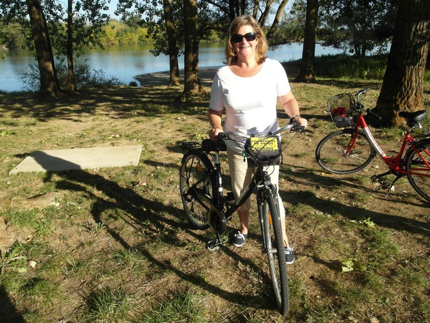 On your velo: Madeleine Keane takes a breather during her 14-kilometre cycle on La Voie Bleue along the river Saone.