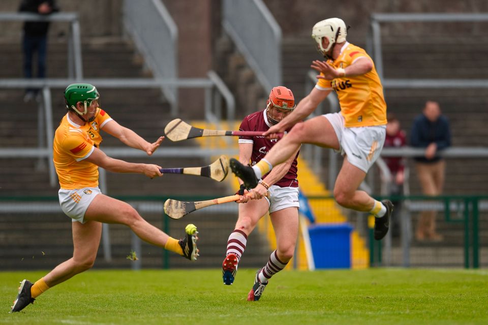Galway's Conor Whelan shoots to score his side’s second goal despite the attempts of Antrim's Gerard Walsh, left, and Paddy Burke during their Leinster SHC Round 4 match between clash at Pearse Stadium, Salthill. Photo: Tom Beary/Sportsfile