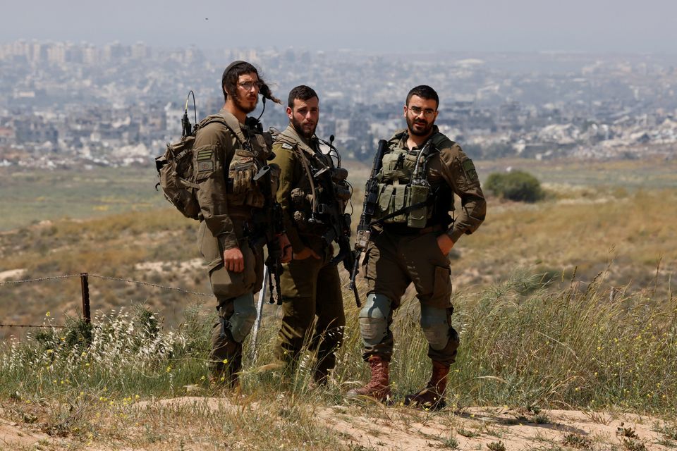 Israeli soldiers patrol near the Israel-Gaza border, amid the ongoing conflict between Israel and the Palestinian Islamist group Hamas, in Israel, April 9, 2024. REUTERS/Amir Cohen
