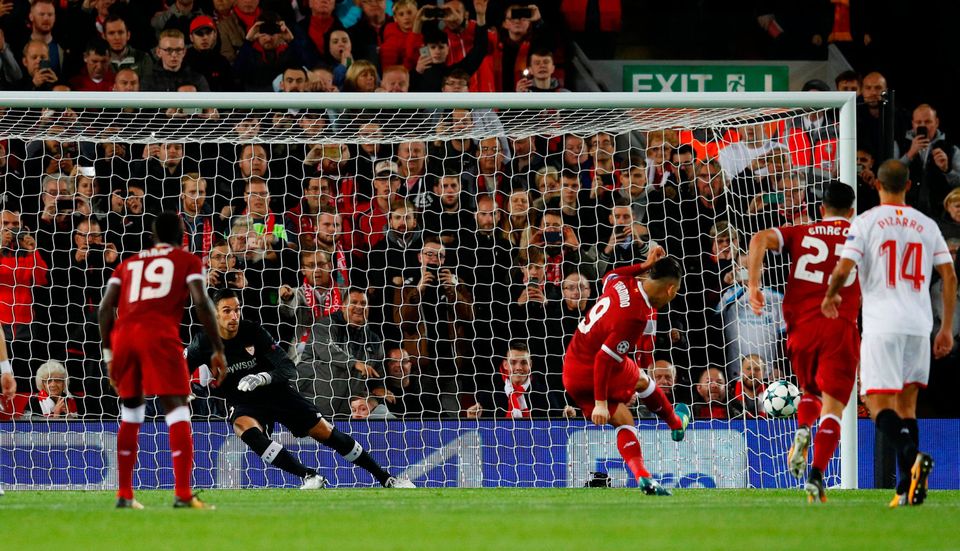 Roberto Firmino hits the post from the penalty spot. Photo: REUTERS