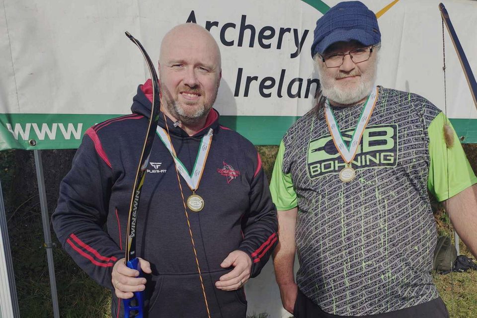 Neil Keeble (left) with his barebow and his CúChulainn Archers clubmate Éamonn Rogers, with just part of his longbow visible. 