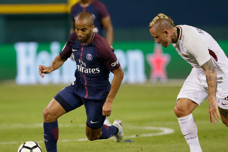 DETROIT, MI - JULY 19:  Lucas Moura #7 of Paris Saint-Germain tries to break away from Radja Nainggolan #4 of AS Roma during the second half at Comerica Park on July 19, 2017 in Detroit, Michigan. (Photo by Duane Burleson/Getty Images)
