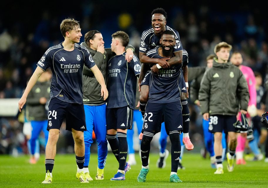 Real Madrid's Vinicius Junior (top) and Real Madrid's Antonio Rudiger celebrate