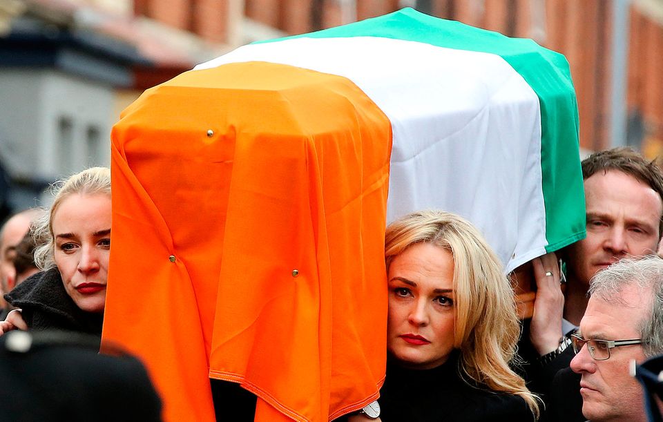 Fionnuala and Gráinne McGuinness carry their father’s remains. Photo: Gerry Mooney