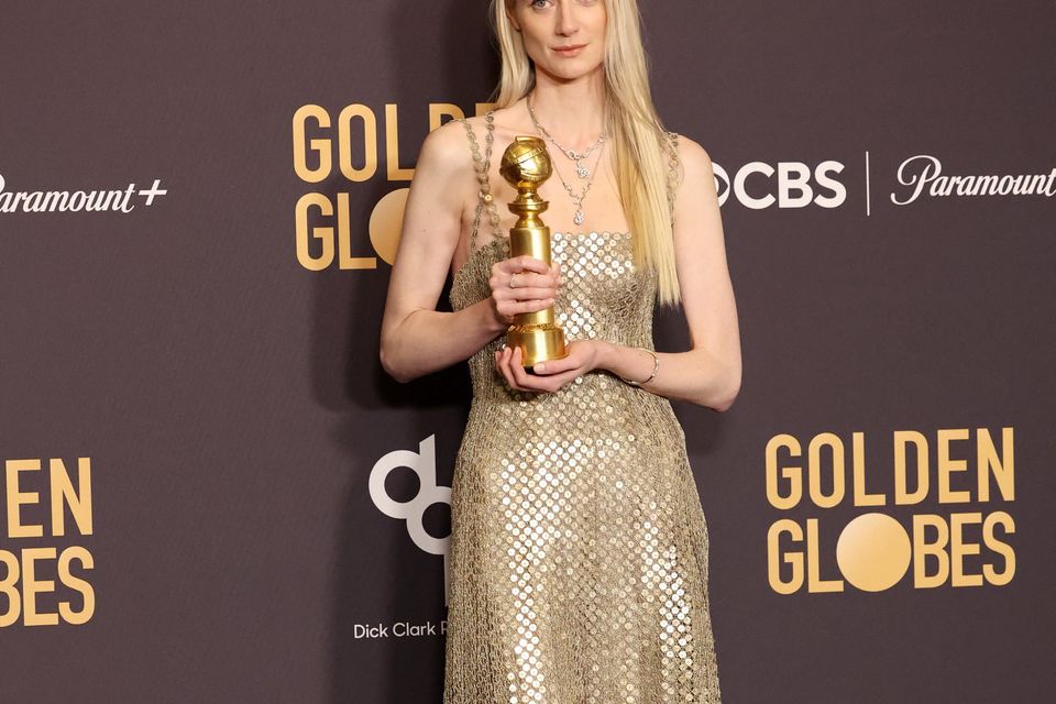 Elizabeth Debicki poses with the award for Best Performance by a Female Actor in a Supporting Role on Television for "The Crown" at the 81st Annual Golden Globe Awards in Beverly Hills, California, U.S., January 7, 2024. REUTERS/Mario Anzuoni