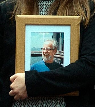 Photo of Michael McCoy carried by a mourner at his funeral Photo: Tony Gavin