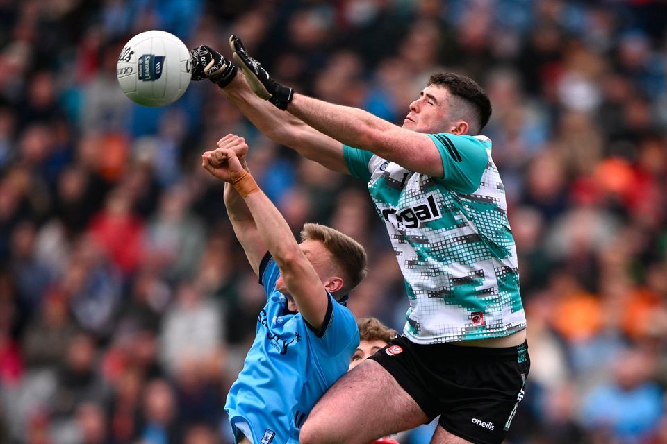Derry goalkeeper Odhran Lynch punches clear under pressure from Cian Murphy of Dublin during last year’s league final at Croke Park. Photo: Sportsfile