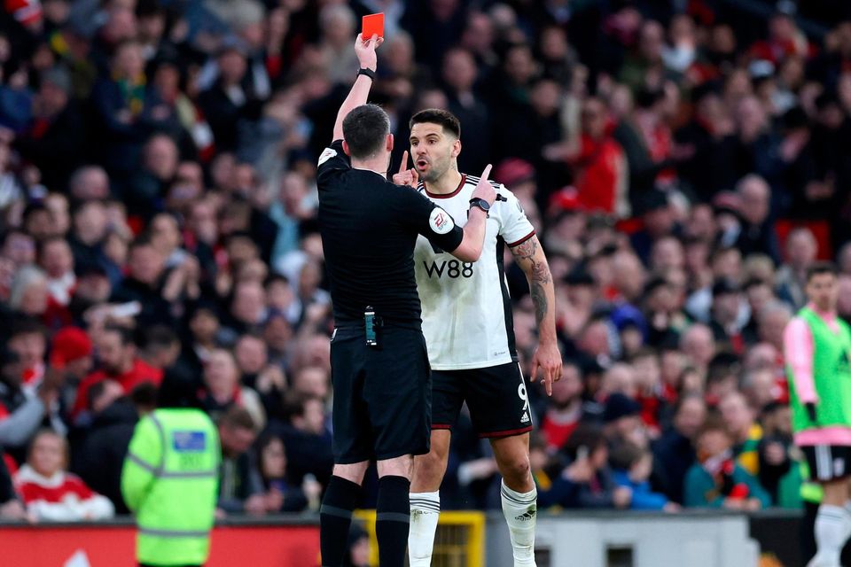 Fulham's Aleksandar Mitrovic receives a red card from referee Chris Kavanagh during the FA cup quarter-final match against Manchester United. Photo: Getty Images