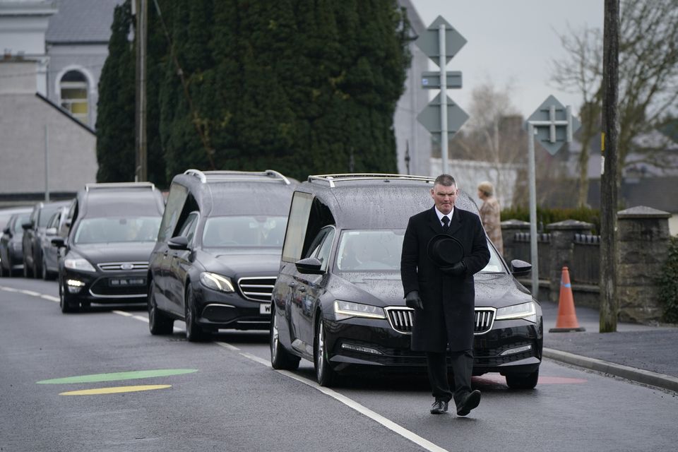 The funeral cortege leaves St Eunan’s Church in Raphoe (Niall Carson/PA)