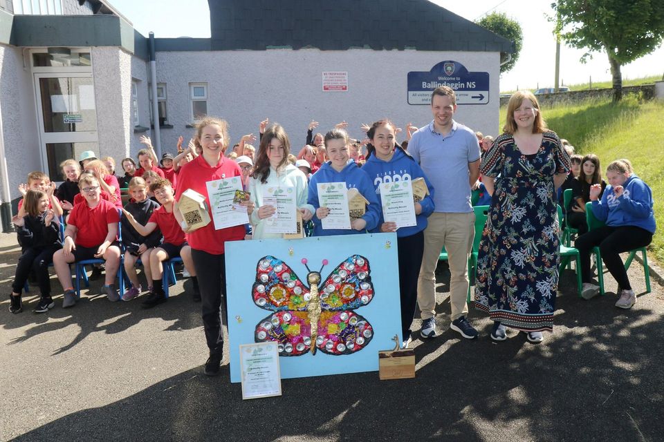 Nellie Fortune, Lily Doyle, Katie Ann Murphy and Niomie King of St.  Colman's NS Ballindaggin, winner of the ECO-UNESCO's Young Environmentalist Award 2023 (junior section) with principal Conor McDonald and Ms.  Aislinn Whitty.