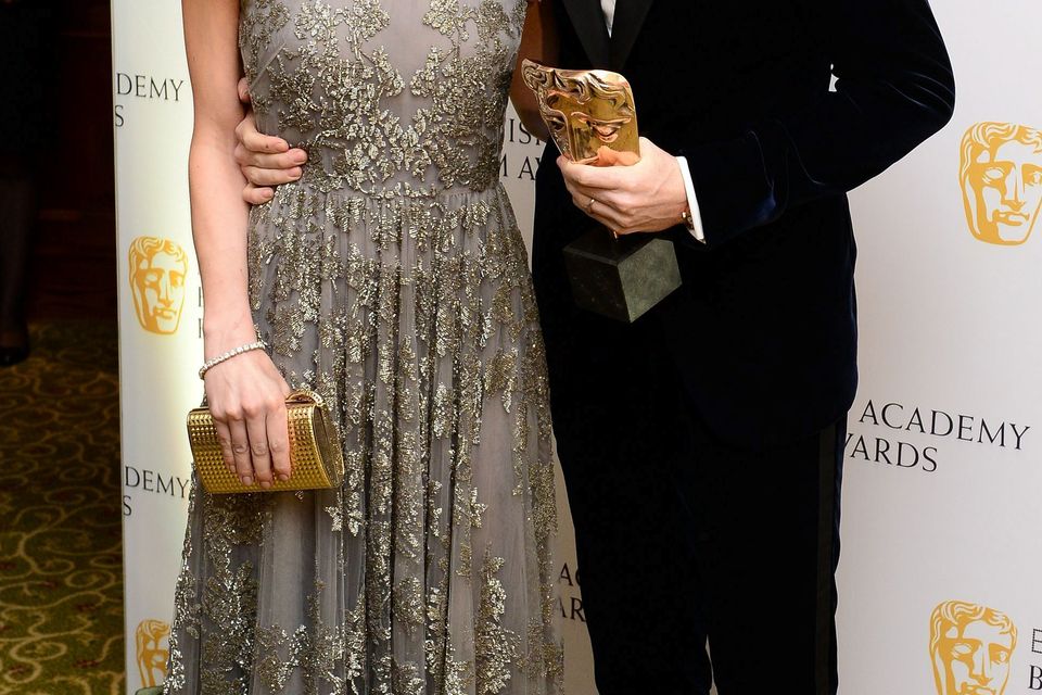 Eddie Redmayne and his wife Hannah Bagshawe attend the after show party for the EE British Academy Film Awards at the Grosvenor House Hotel in central London. PRESS ASSOCIATION Photo. Picture date: Sunday February 8, 2015. See PA story SHOWBIZ Bafta. Photo credit should read: Dominic Lipinski/PA Wire