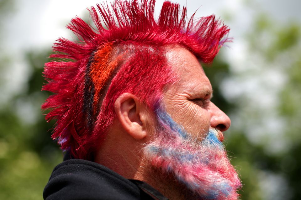 Festivalgoer Lindsay Mellor from Glastonbury shows off his Union Jack beard and haircut, a tribute to David Bowie