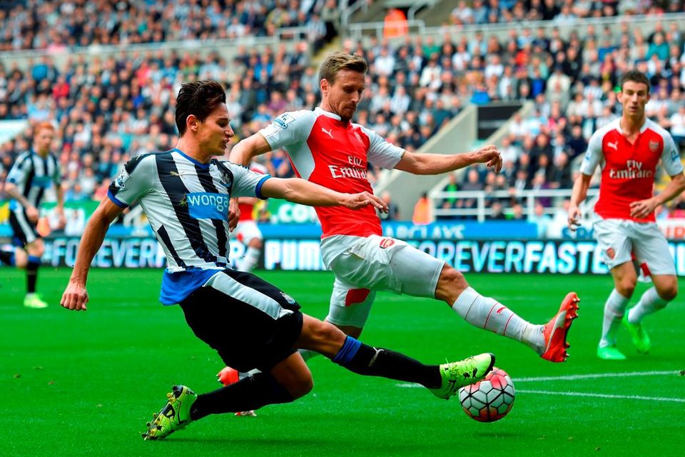 Newcastle player Florian Thauvin has his shot blocked by Arsenal defender Nacho Monreal